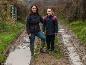 girl gets stuck in deep mud after council ordered her to take 3 mile route to school daily
