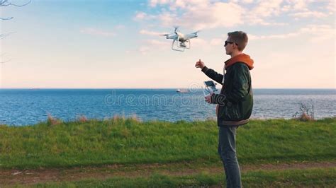 quadrocopter takes    pilots hand  slow motion running  dron stock footage