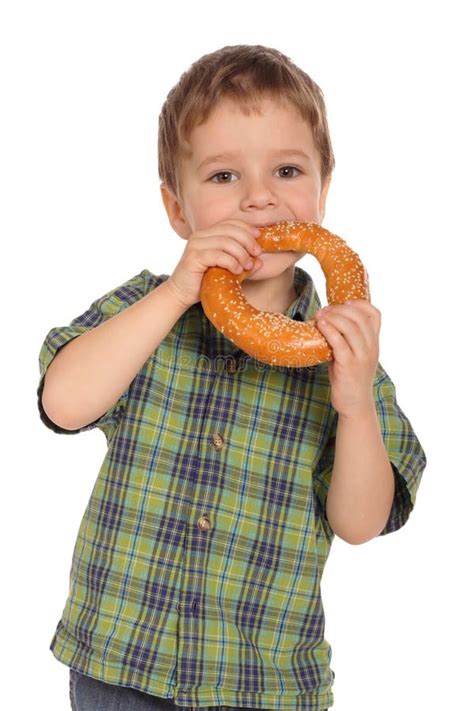 boy eating bagel stock image image  people