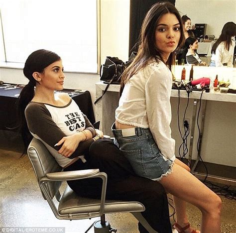 Kendall Jenner Models For Estee Lauder In A Plunging Scarlet Suit