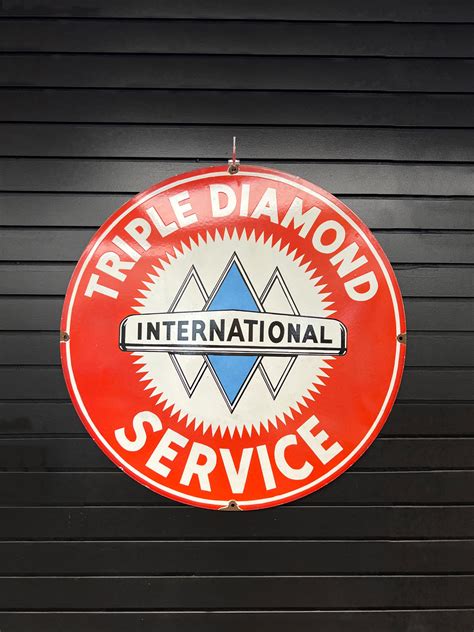 xdiamond international triple diamond sign