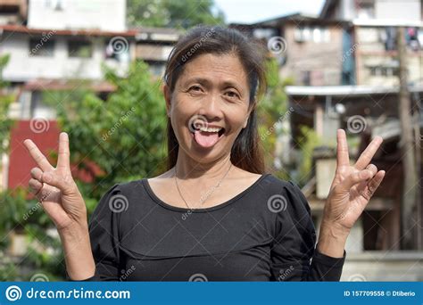 A Filipina Woman Making Funny Faces Arkivfoto Bild Av Lycka Lady