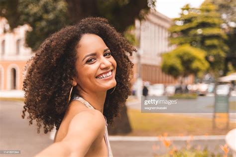 Follow Me Pov Of Young Brazilian Woman Smiling And Holding Hands High