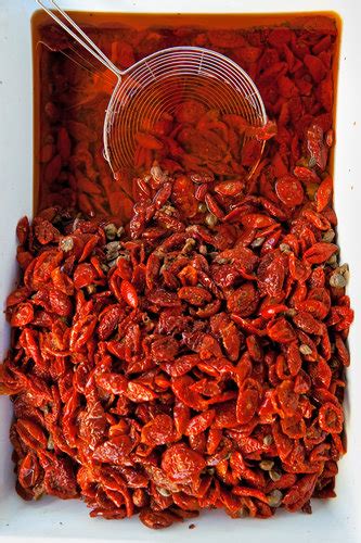 exploring cefalù sicily sundried tomatoes with capers from a market