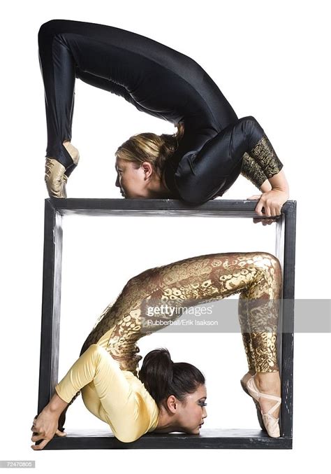 female contortionist duo with box prop photo getty images