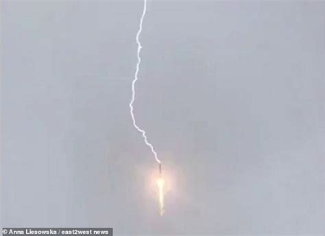 electrifying footage shows the moment lightning strikes a russian soyuz rocket during launch