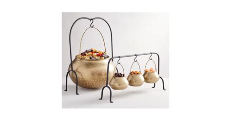 gold cauldron serveware collection these boho halloween decorations are magical popsugar