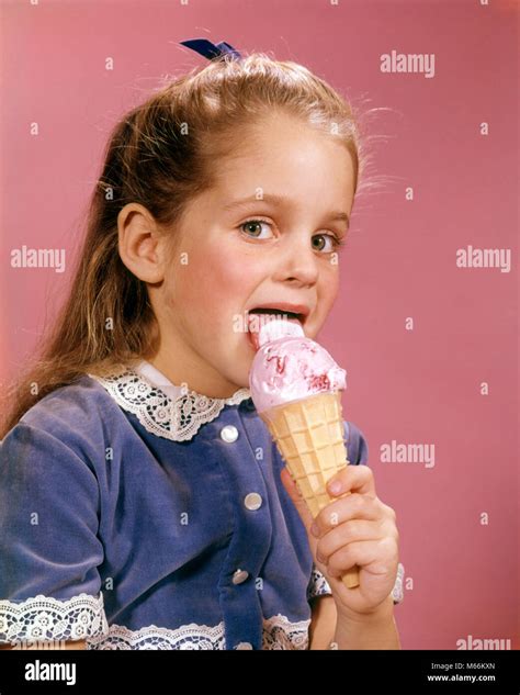 1960s Brunette Girl Blue Dress Licking Strawberry Ice Cream Cone
