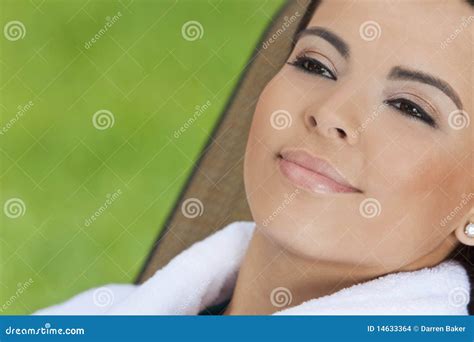 beautiful hispanic woman  white bathrobe  spa stock photo image