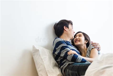 Happy And Smiling Attractive Young Cute Asian Couple In Love Hugging And
