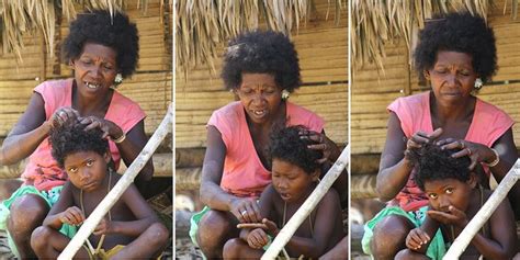 bateq semang woman picking lice   daughters hair  bateq  spelled batiq  batek