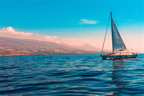 sailboat sailing  water  island  stock photo