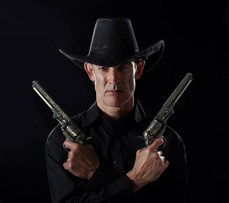 royalty  gunslinger pictures images  stock  istock