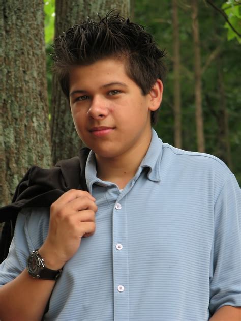 boy teen  stock photo  young latino teen boy posing outdoors   tree