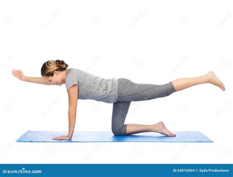 woman making yoga  balancing table pose  mat stock photo image