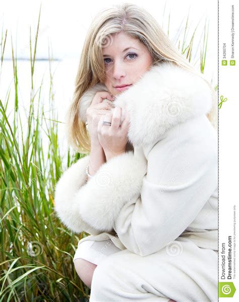 beautiful blonde woman in white fur coat stock images image 34260704
