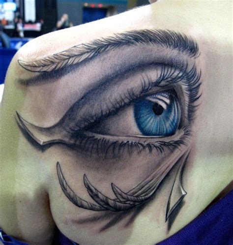 Realistic Colored Blue Eye Tattoo On Left Back Shoulder