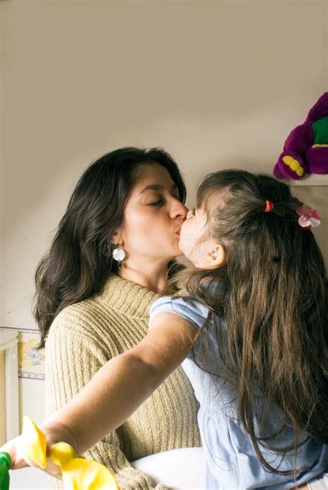 A Mother And A Daughter Kissing Picture Image 5301805