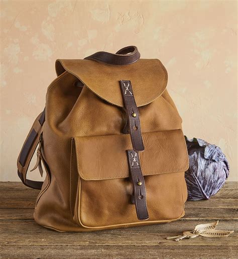 morgan backpack  timeless drawstring style backpack features  flap  strap closure