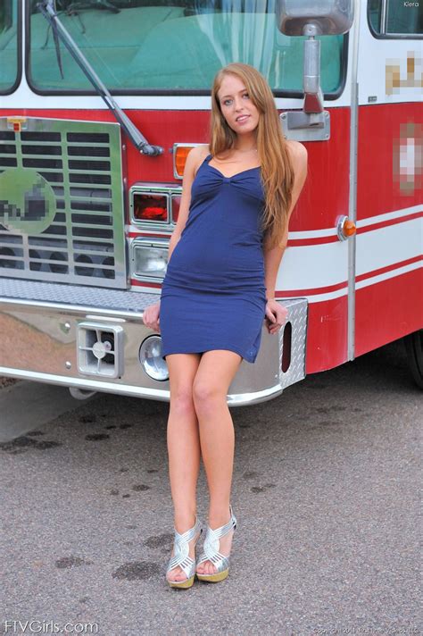 wild redhead kiera shows off her amazing curves on a fire truck
