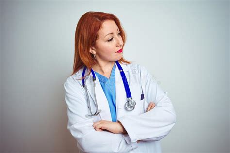 Young Redhead Doctor Woman Using Stethoscope Over White Isolated