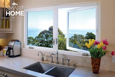 casement kitchen windows  sink overlooking treeline  ocean wooden casement windows