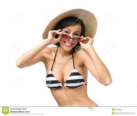 bikini sombrero y gafas de sol que llevan de la muchacha foto de archivo libre de regalías