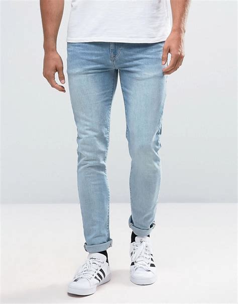 lyst asos skinny jeans in light wash in blue for men
