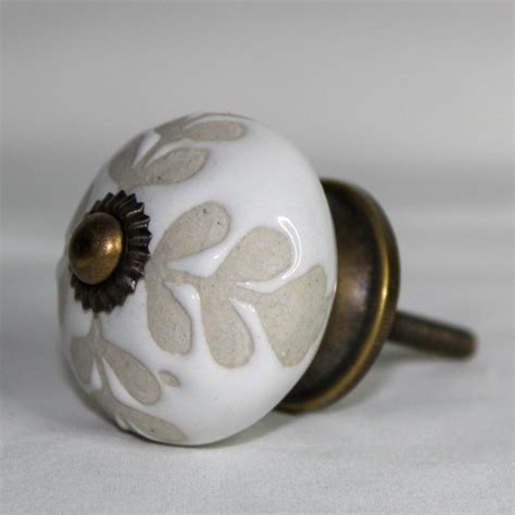 white ceramic knob  guilded lily trading