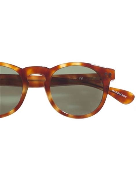 semi round sunglasses in amber with green lenses