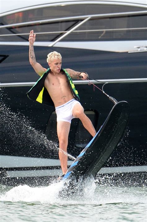 Justin Bieber Flashes Bum In Soaking White Pants As He Gets Wet And