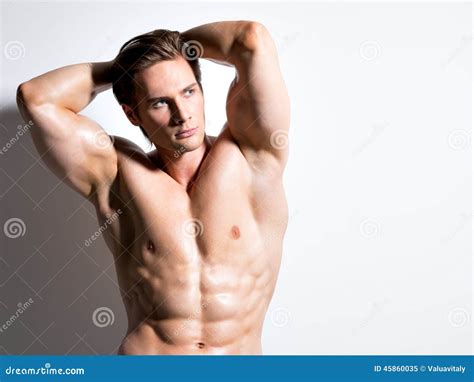 muscular handsome man  hands  head stock image image  health stomach
