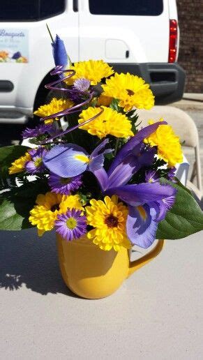 Purple And Yellow Coffee Cup Flower Arrangement With Iris