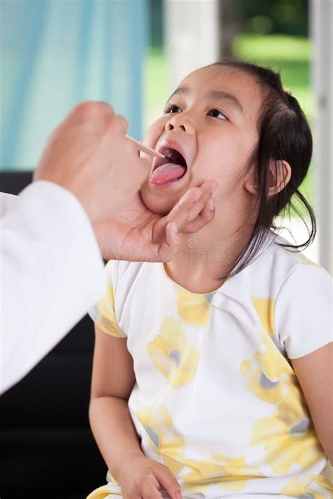 asian girl during throat examination stock image image of diversity