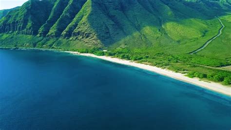 Tropical Hawaiian Beach With Blue Ocean Green Rainforest