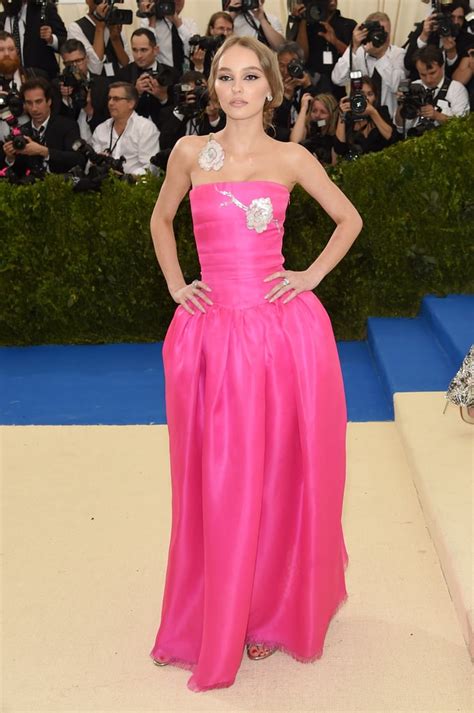 lily rose depp wearing a hot pink strapless gown lily rose depp