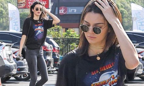 kendall jenner wears skinny jeans as she gets her cameras