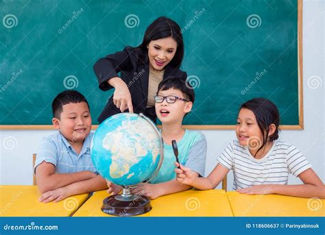 teacher  students studying geography  class stock image image