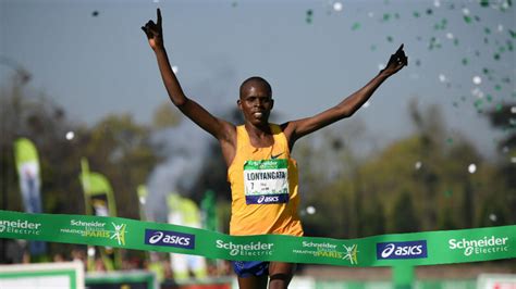 kenyan husband  wife duo wins paris marathon