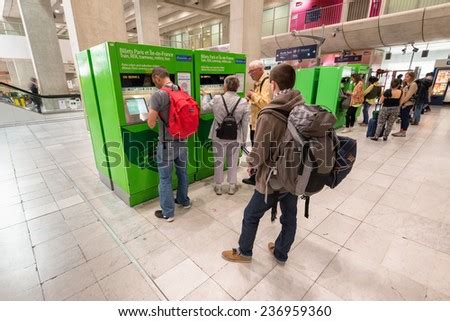 paris france june   tourists buying   ticket machines located  charles