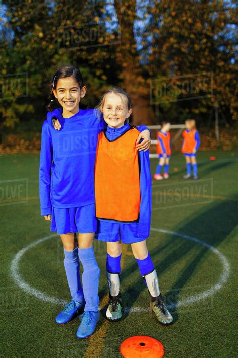 portrait smiling confident girl soccer players stock photo dissolve