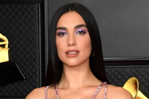 dua lipa wows in a cutout gown and jewel heels at the grammy