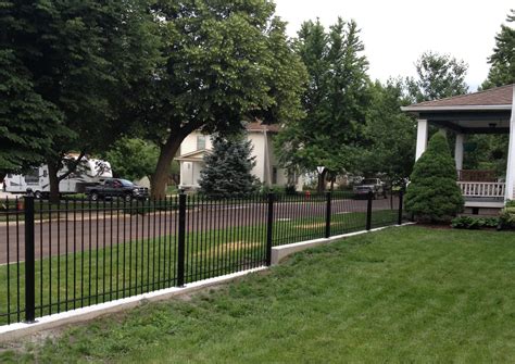 install iron fence  aluminum fence   hill slope  grade