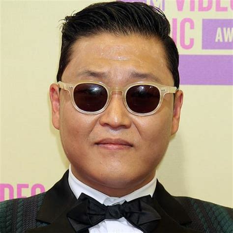 psy net worth   magnifying glass  rich