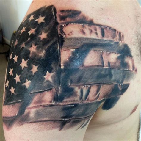 wavy american flag tattoo on man left shoulder