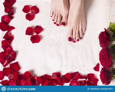 beautiful female feet   red pedicure   bath  salt  rose