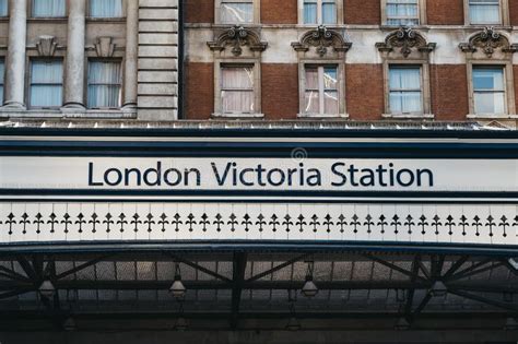 station name sign outside victoria train station london uk editorial