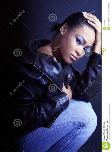 teenage african american girl kneeling and looking sexy