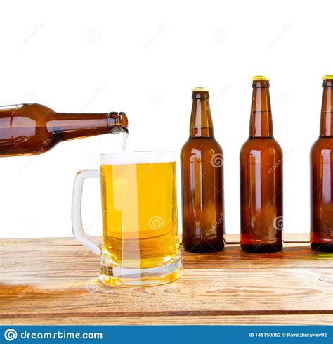 Glass And Bottle Of Beer With No Logos On Wooden Table