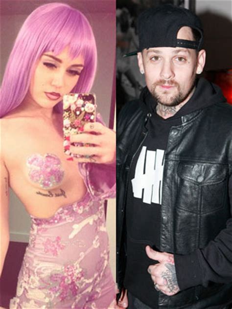 new hookup miley cyrus and benji madden caught kissing on halloween